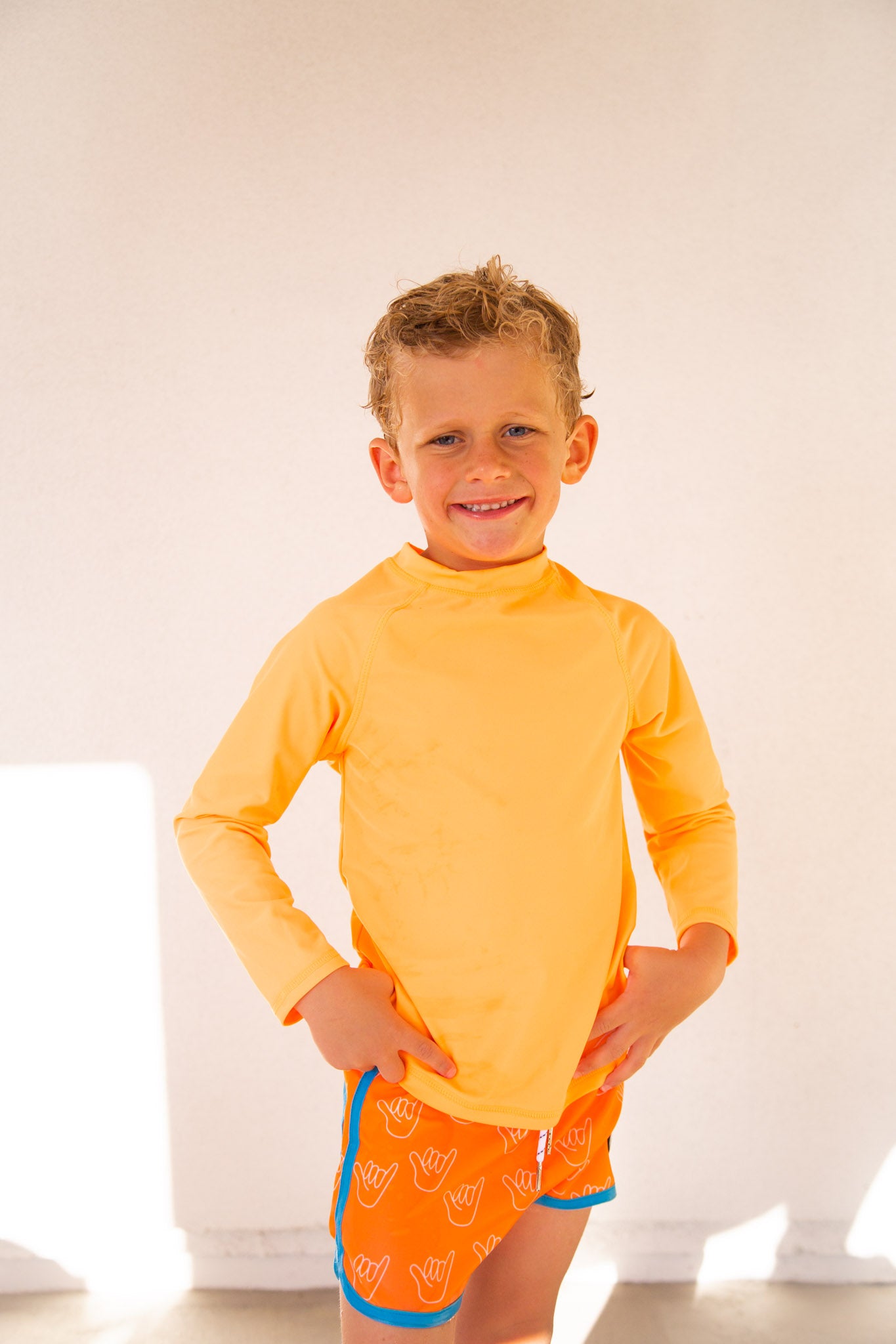 ORANGE BRITE RASH GUARD